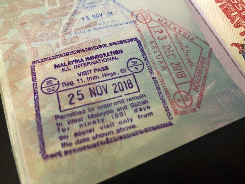KL tourist visa stamp in passport