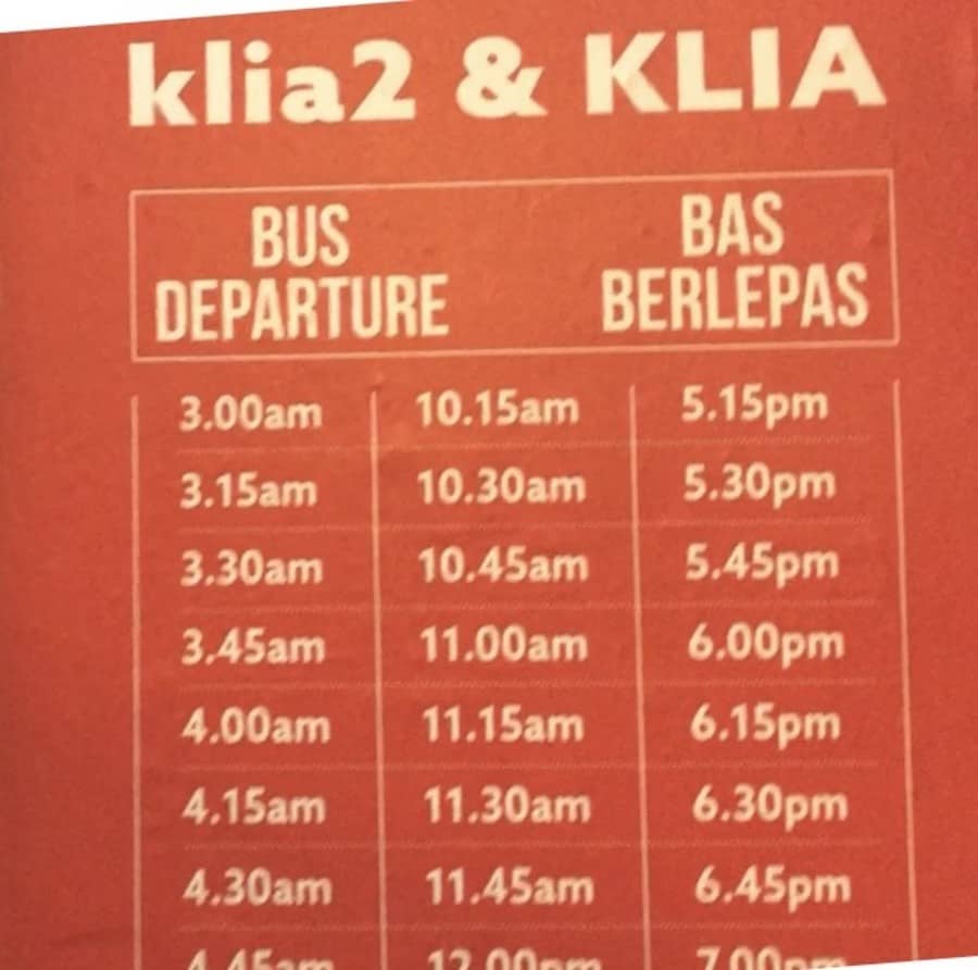 A sign showing some of the bus departure times from KL Sentral.