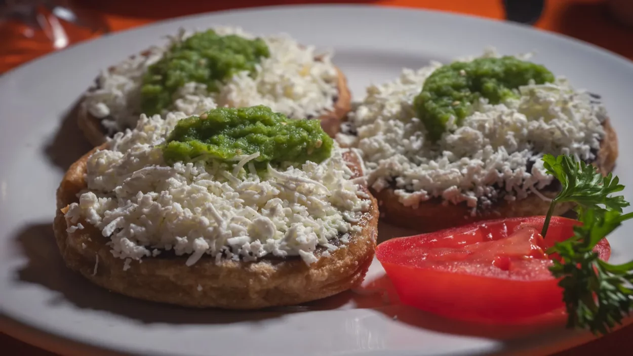 Sopes/picaditas acapulquenas corn sopes topped with refried black beans fresh