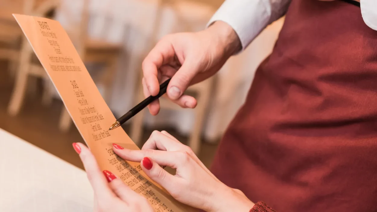 customer asking waiter about menu