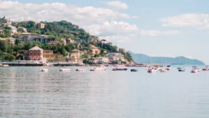 coastal view of rapallo italy with boats on calm sea