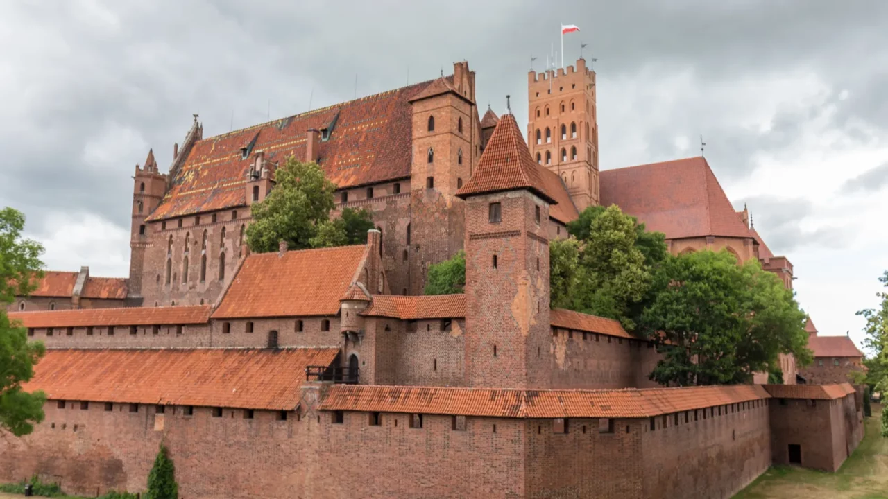 Malbork Castle stands out as one of Europe’s most impressive Gothic landmarks